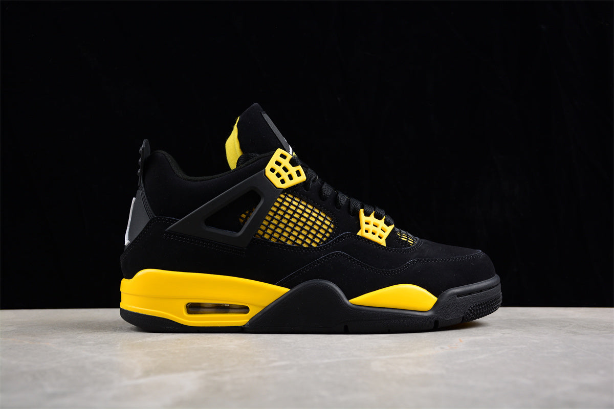 Black and yellow sneaker on a dark background