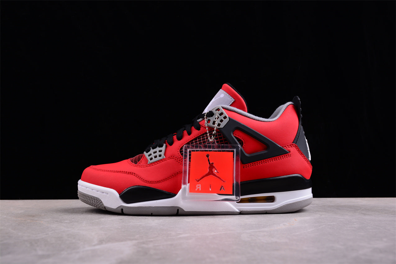 Red and black sneaker with a clear box on a gray surface and black background