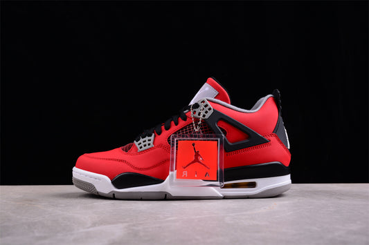 Red and black sneaker with a clear box on a gray surface and black background