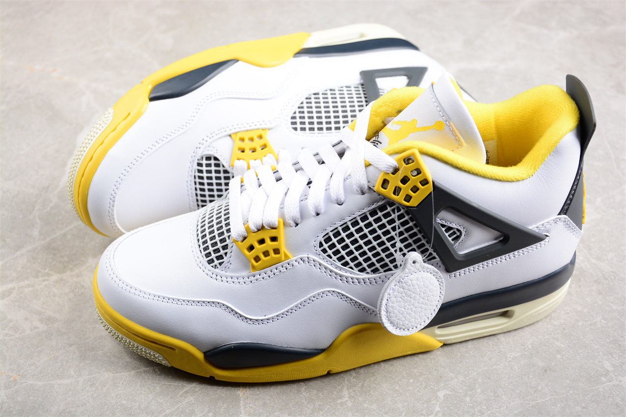 White and yellow sneakers with black accents on a gray surface
